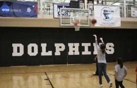 student playing basketball