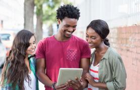 Students looking at a tablet