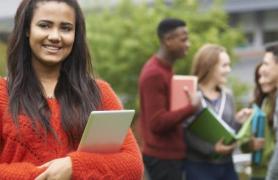 girl and students in background on campus English major