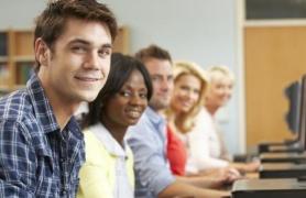 students in front of lap top computers