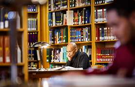 male student in library