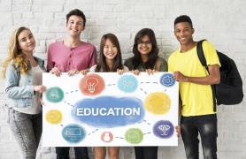 students holding education sign in distance learning classes