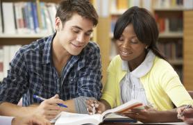 Student receiving tutoring from a peer