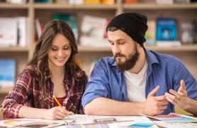 Students completing forms