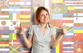 Student in front of flags