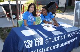 students at table welcoming New Students To Campus
