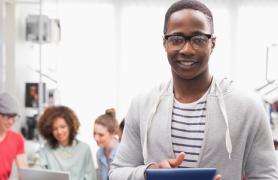 Student Holding Tablet In Class
