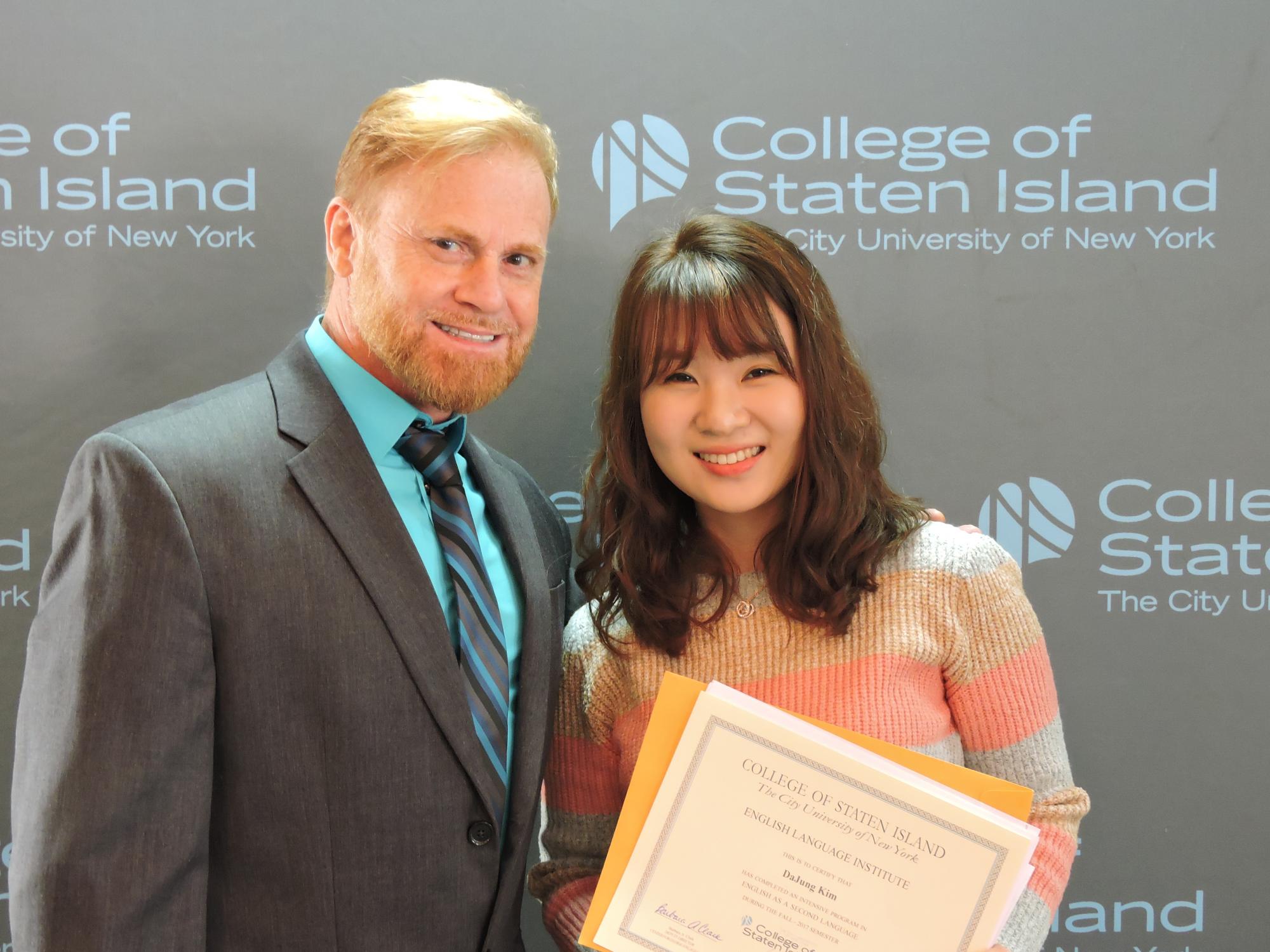 ELI teacher with Korean student during ELI graduation